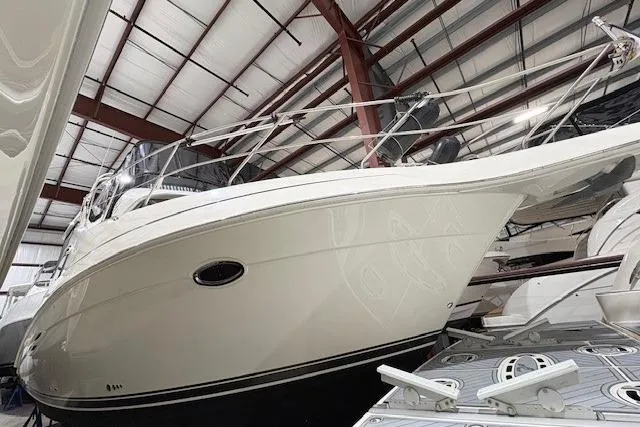 Go Jump In The Lake Yacht Photos Pics 2003 Silverton 39 Motor Yacht in storage, showcasing sleek design and sturdy construction.