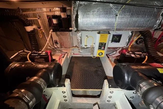 Go Jump In The Lake Yacht Photos Pics Engine room of 2003 Silverton 39 Motor Yacht with visible machinery and wiring.