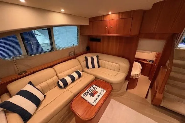 Go Jump In The Lake Yacht Photos Pics Luxurious interior of 2003 Silverton 39 Motor Yacht with plush seating and elegant wood finishes.