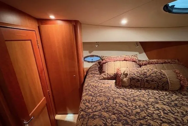 Go Jump In The Lake Yacht Photos Pics Luxurious cabin interior of 2003 Silverton 39 Motor Yacht with elegant bedding.