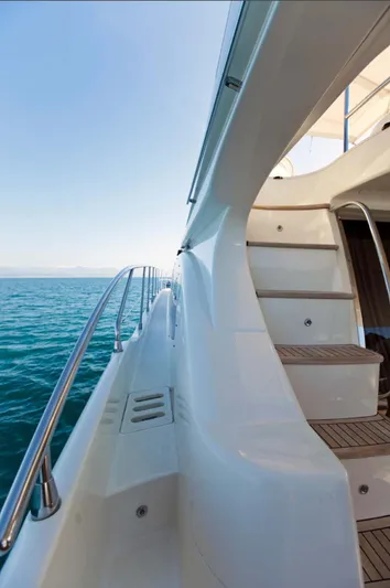  Yacht Photos Pics Side view of 2006 Azimut 62 yacht with sleek design and ocean backdrop.