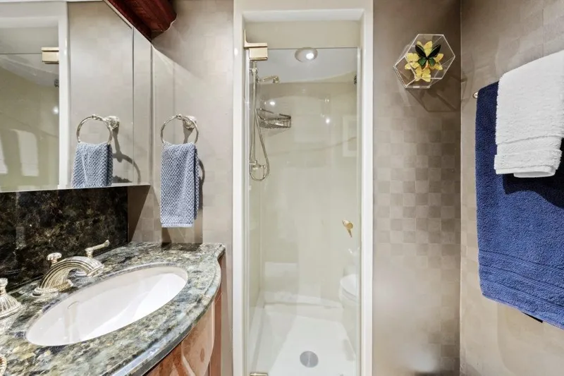 Amajen Yacht Photos Pics Luxurious bathroom in 2006 Cheoy Lee Motor Yacht with elegant fixtures and modern design.