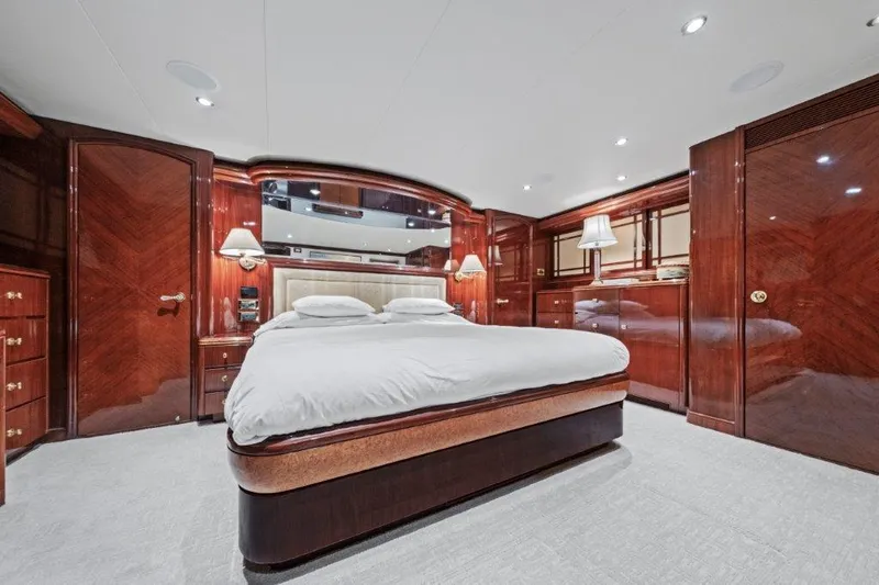 Amajen Yacht Photos Pics Luxurious 2006 Cheoy Lee motor yacht bedroom with elegant wood paneling and modern lighting.