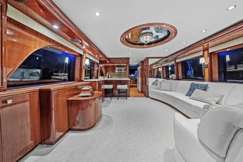 Amajen Yacht Photos Pics Luxurious interior of 2006 Cheoy Lee Motor Yacht with elegant wood finishes and plush seating.