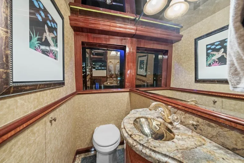 Amajen Yacht Photos Pics Luxurious bathroom in 2006 Cheoy Lee Motor Yacht with elegant fixtures and framed artwork.