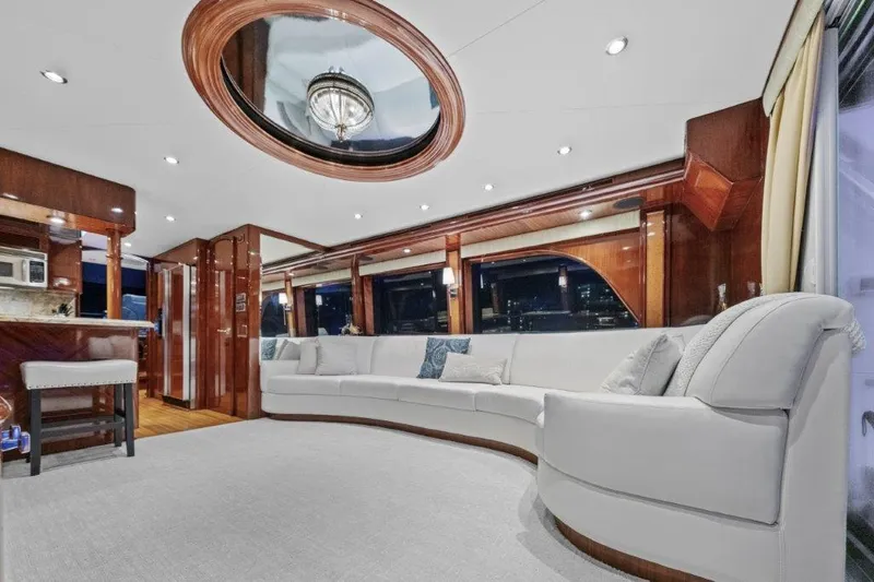 Amajen Yacht Photos Pics Luxurious interior of 2006 Cheoy Lee Motor Yacht with elegant seating and wood accents.