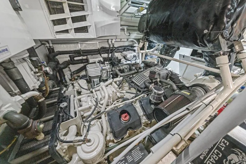 Amajen Yacht Photos Pics Engine room of a 2006 Cheoy Lee Motor Yacht, showcasing complex machinery and components.