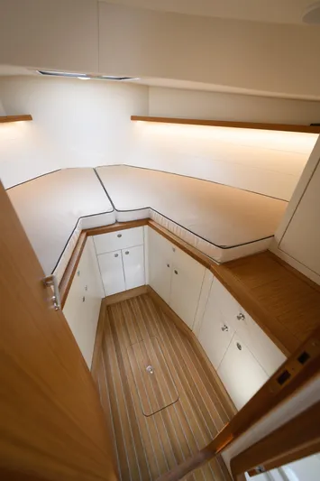 36 Yacht Photos Pics Modern boat interior with wooden flooring and sleek cabinetry, Toy 36 model, 2025.