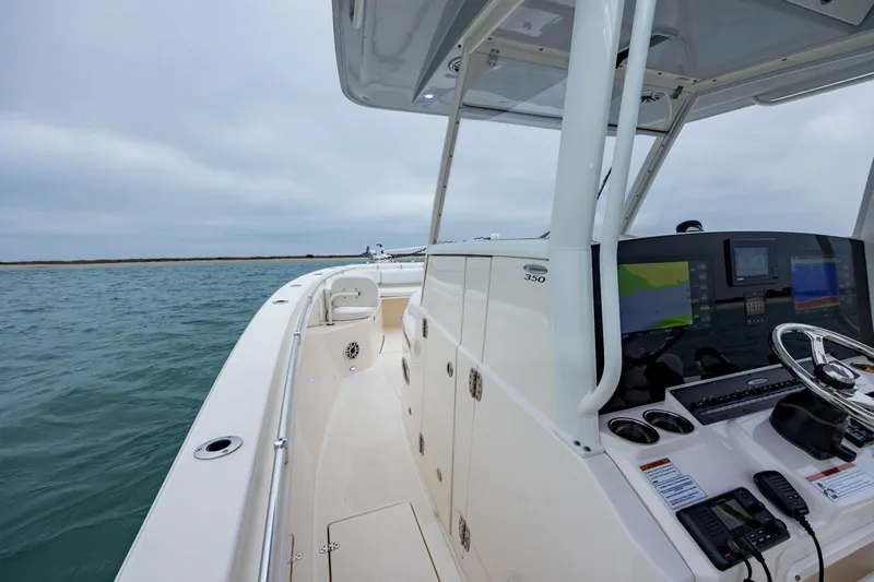  Yacht Photos Pics 2020 Cobia 350 Center Console boat on water, featuring modern navigation equipment.