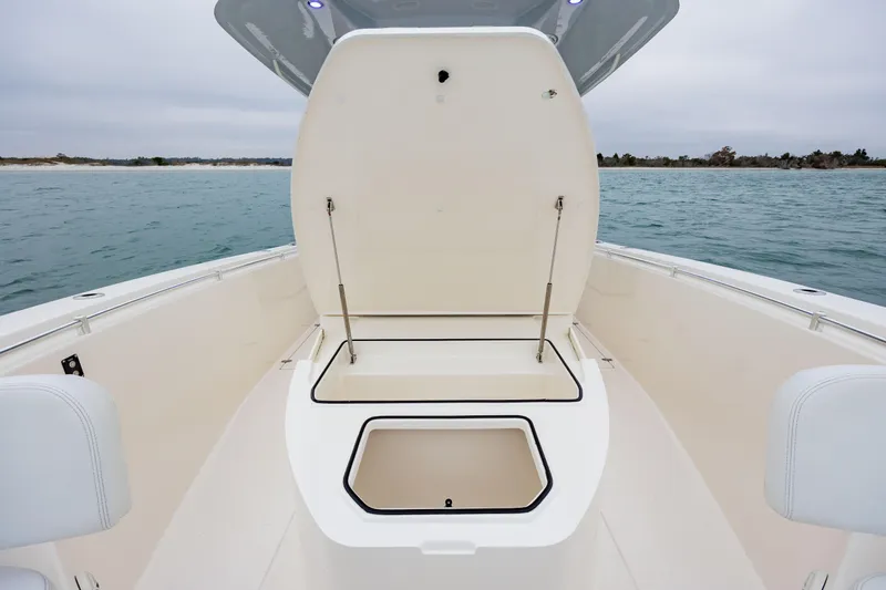  Yacht Photos Pics 2020 Cobia 350 Center Console boat with open storage compartment on deck.