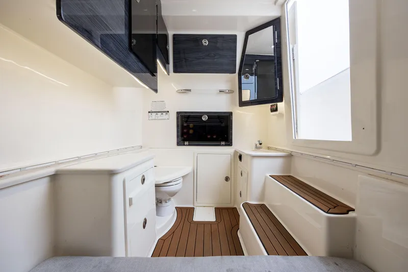  Yacht Photos Pics 2020 Cobia 350 Center Console interior with modern amenities and wood accents.