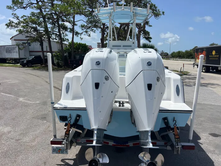  Yacht Photos Pics 2023 Contender 25 Tournament boat with dual outboard engines, parked on a trailer.