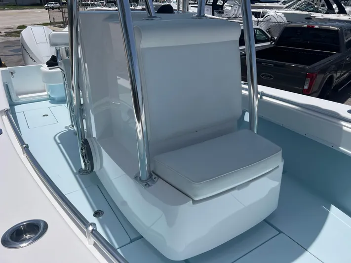  Yacht Photos Pics 2023 Contender 25 Tournament boat interior with seating and console, showcasing sleek design.