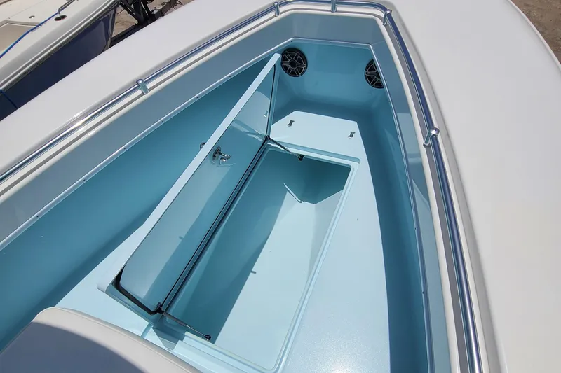  Yacht Photos Pics 2023 Contender 25 Tournament boat interior with storage compartment and speakers.