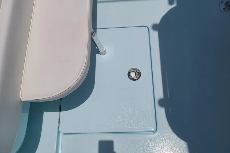  Yacht Photos Pics 2023 Contender 25 Tournament boat deck with seating and storage compartment.