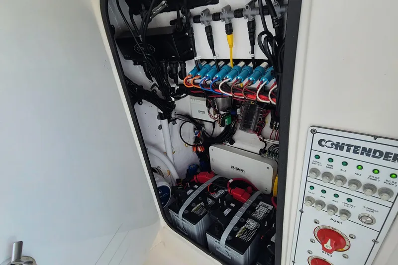  Yacht Photos Pics 2023 Contender 25 Tournament boat electrical panel and battery compartment.