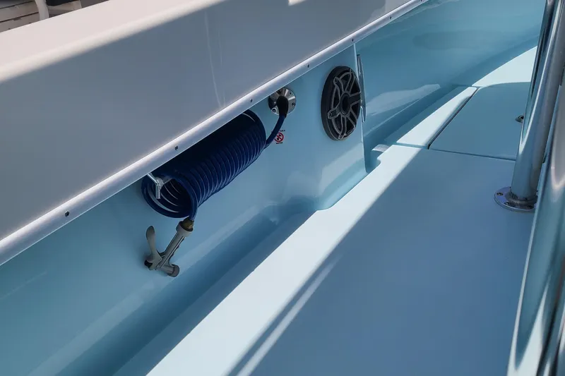  Yacht Photos Pics 2023 Contender 25 Tournament boat interior with coiled hose and speaker.