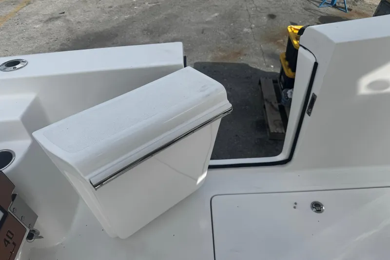  Yacht Photos Pics 2026 Sea Pro 262 Offshore boat deck with storage compartment and seating.