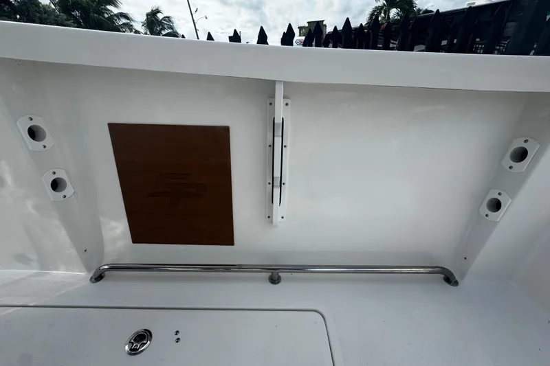  Yacht Photos Pics 2026 Sea Pro 262 Offshore boat interior with rod holders and storage compartment.