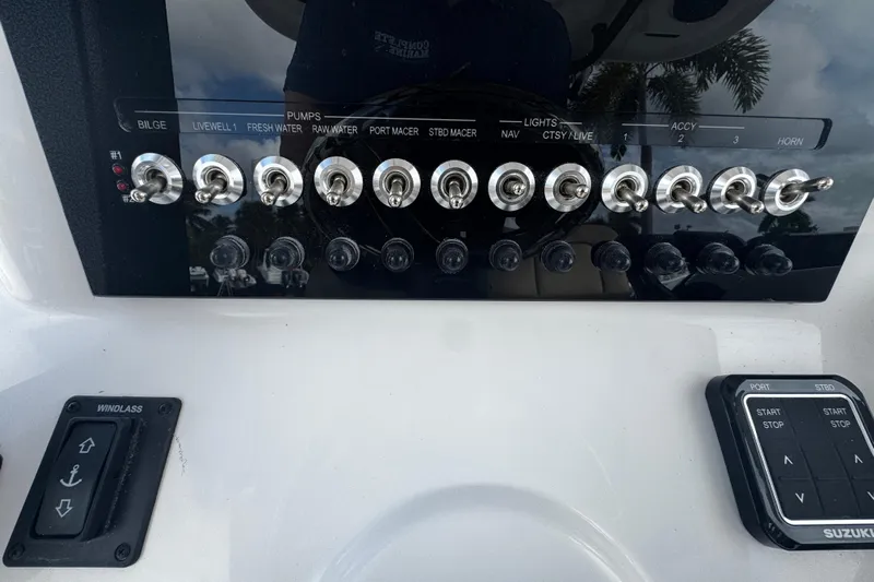  Yacht Photos Pics Control panel of 2026 Sea Pro 262 Offshore boat with switches and buttons.