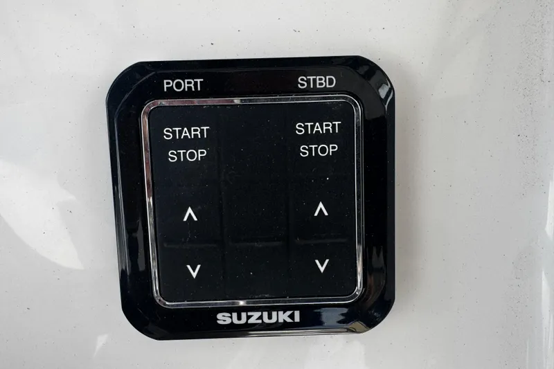  Yacht Photos Pics Control panel of a 2026 Sea Pro 262 Offshore boat with Suzuki engine controls.