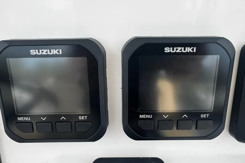  Yacht Photos Pics Dual Suzuki displays on 2026 Sea Pro 262 Offshore boat dashboard.