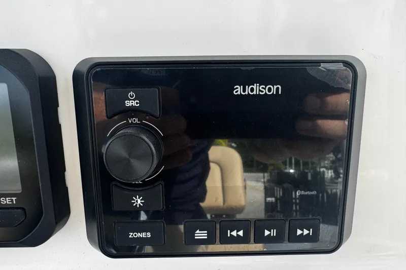  Yacht Photos Pics Audison audio control panel on 2026 Sea Pro 262 Offshore boat dashboard.