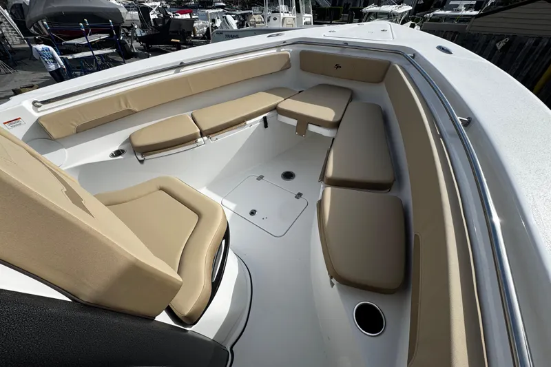  Yacht Photos Pics 2026 Sea Pro 262 Offshore boat interior with tan cushioned seating.