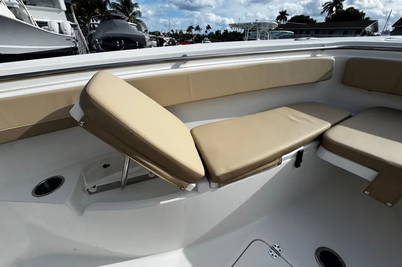  Yacht Photos Pics 2026 Sea Pro 262 Offshore boat interior with adjustable tan seating and cup holder.