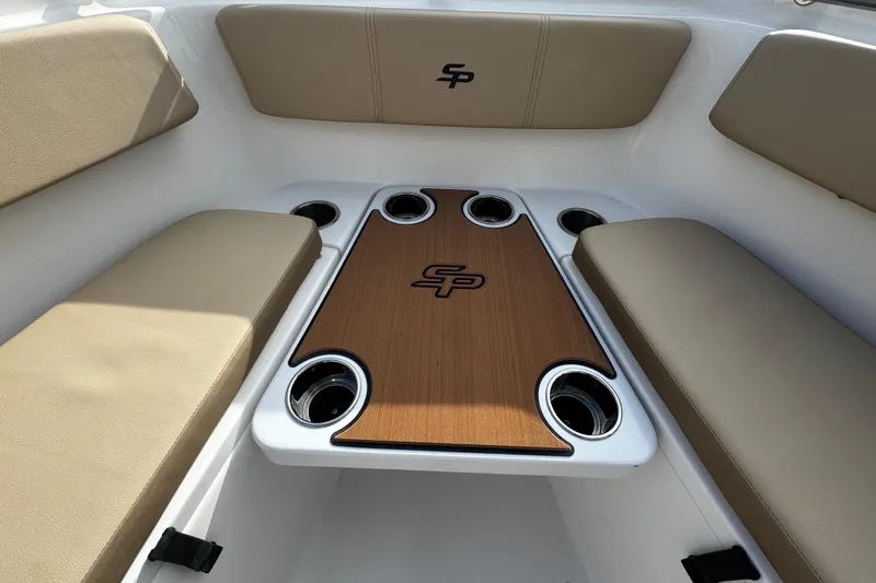  Yacht Photos Pics 2026 Sea Pro 262 Offshore boat interior with cushioned seating and table.