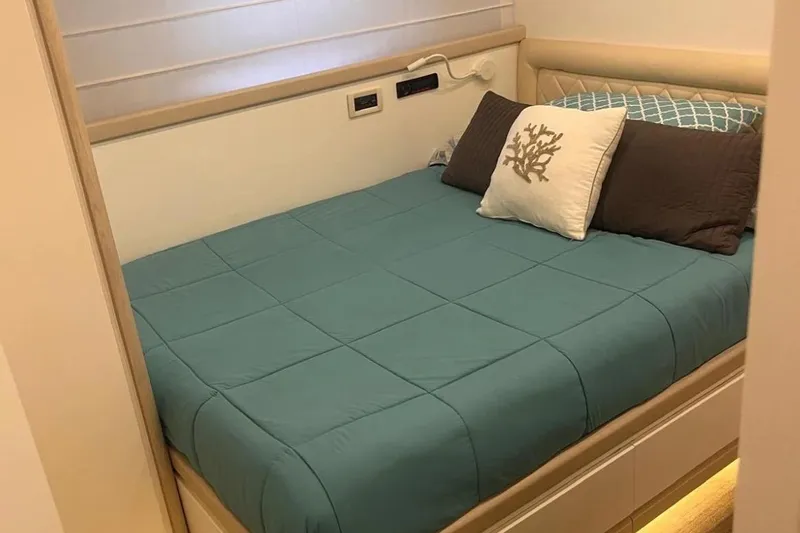  Yacht Photos Pics Luxurious bedroom interior on a 2005 Posillipo Technema 80 yacht, featuring elegant bedding.