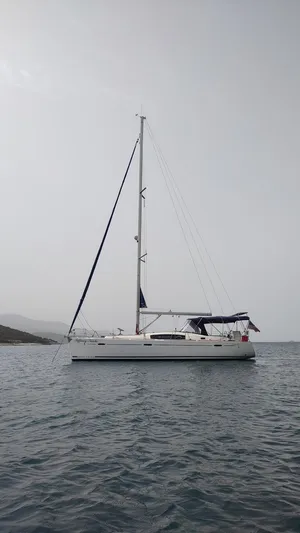 Tiffany Nicole Yacht Photos Pics 2011 Beneteau Oceanis 43 Family sailboat on calm water, overcast sky.