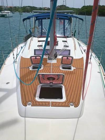 Tiffany Nicole Yacht Photos Pics 2011 Beneteau Oceanis 43 Family sailboat deck with wood finish, anchored in calm waters.