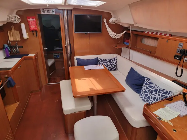 Tiffany Nicole Yacht Photos Pics Interior of 2011 Beneteau Oceanis 43 Family yacht with cozy seating and wooden finishes.