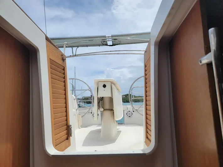 Tiffany Nicole Yacht Photos Pics Beneteau Oceanis 43 Family yacht cockpit view, showcasing helm and open hatch, 2011 model.