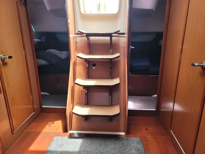 Tiffany Nicole Yacht Photos Pics Interior of 2011 Beneteau Oceanis 43 Family yacht with wooden stairs and cabin doors.