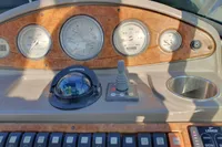 Dashboard of a 2008 Rinker 260 boat with gauges and controls.