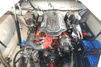 Engine compartment of a 2008 Rinker 260 boat, showcasing the engine and components.