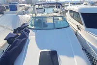 2008 Rinker 260 boat docked among other vessels in a marina.