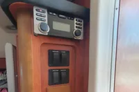 2008 Rinker 260 boat interior with Clarion stereo system and control panel.