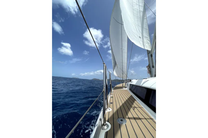 Lazy Days Yacht Photos Pics Sailing on a 2015 Jeanneau Sun Odyssey 469 yacht under clear blue skies.