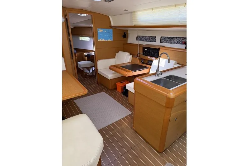 Lazy Days Yacht Photos Pics Interior of 2015 Jeanneau Sun Odyssey 469 yacht with modern kitchen and seating area.
