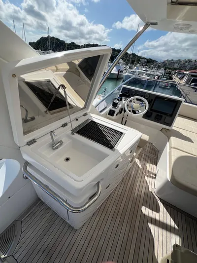 Lula Yacht Photos Pics 2016 Azimut 54fly yacht with outdoor sink and helm, docked at marina.