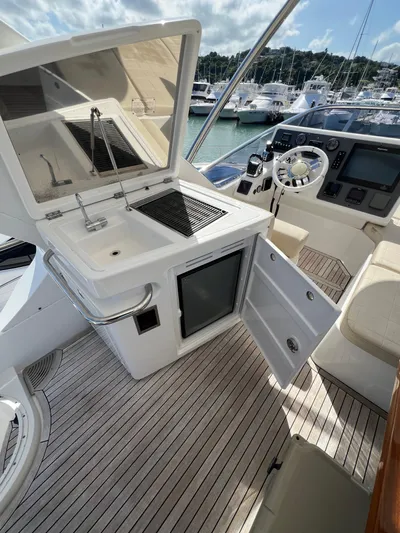 Lula Yacht Photos Pics 2016 Azimut 54fly yacht cockpit with open kitchenette and steering area.