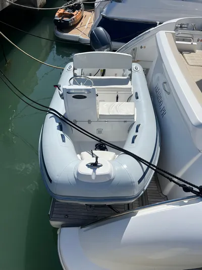 Lula Yacht Photos Pics 2016 Azimut 54fly yacht with inflatable tender docked in marina.