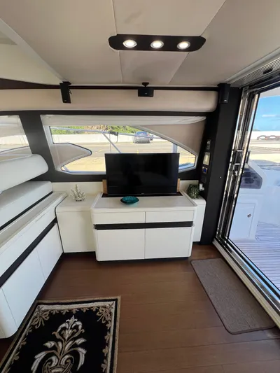 Lula Yacht Photos Pics Luxurious interior of 2016 Azimut 54fly yacht with modern furnishings and large windows.