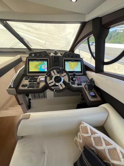 Lula Yacht Photos Pics 2016 Azimut 54fly yacht cockpit with modern navigation systems and luxurious seating.