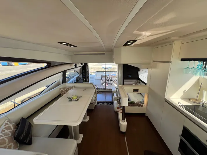 Lula Yacht Photos Pics Luxurious interior of 2016 Azimut 54fly yacht with modern dining and kitchen area.
