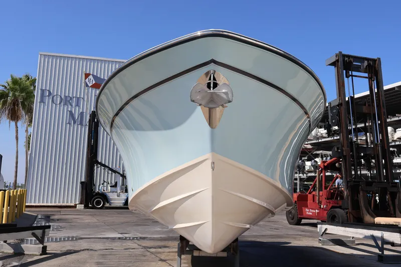  Yacht Photos Pics 2017 Grady-White Canyon 306 boat at marina, front view, clear sky.