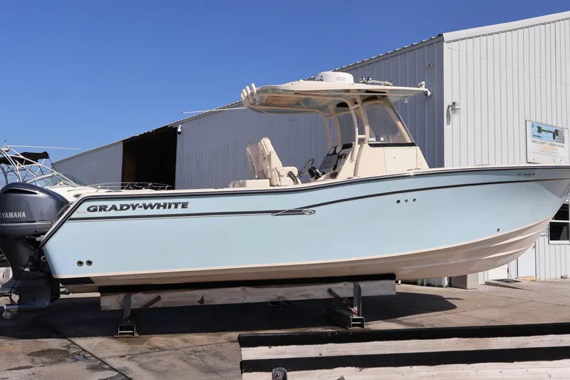  Yacht Photos Pics 2017 Grady-White Canyon 306 boat on display outside a warehouse.